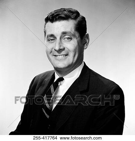 Picture - Portrait of mature businessman smiling, studio shot. Fotosearch