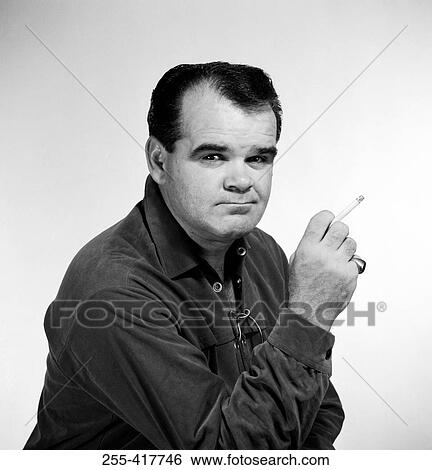 Portrait of mature man smoking cigarette View Large Photo Image Stock Photograph - Portrait of mature man smoking cigarette. Fotosearch