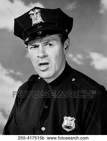 Portrait of police officer frowning View Large Photo Image Stock Image - Portrait of police officer frowning. Fotosearch