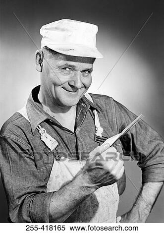 Stock Photography - Portrait of smiling manual worker. Fotosearch