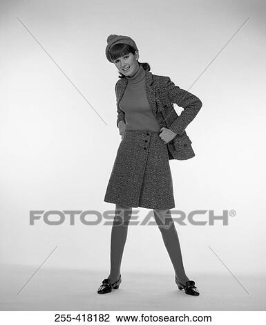 Portrait of standing woman in knit hat View Large Photo Image Stock Image - Portrait of standing woman in knit hat. Fotosearch