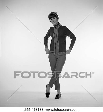 Portrait of standing woman in knit hat View Large Photo Image Stock Image - Portrait of standing woman in knit hat. Fotosearch