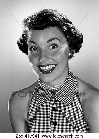 Stock Image - Portrait of surprised young woman. Fotosearch