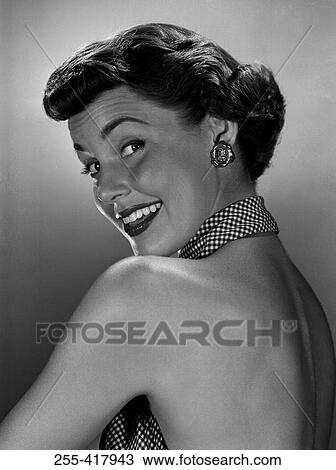 Stock Image - Portrait of surprised young woman. Fotosearch