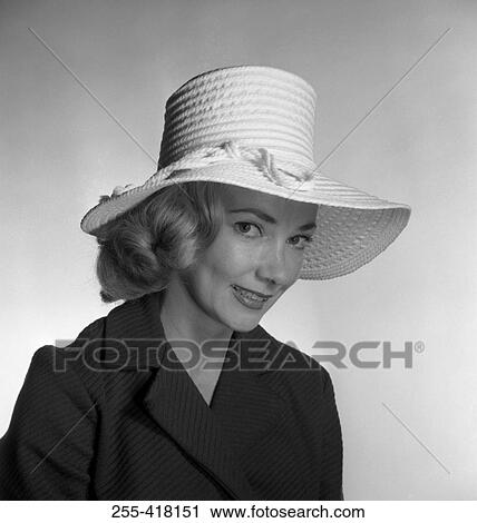 Stock Image - Portrait of woman in hat. Fotosearch