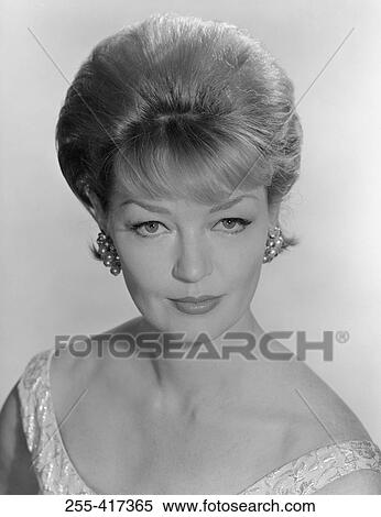 Stock Photography - Portrait of young elegant woman, studio shot. Fotosearch