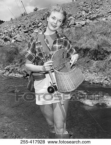 Portrait of young woman fishing View Large Photo Image Stock Photo - Portrait of young woman fishing. Fotosearch