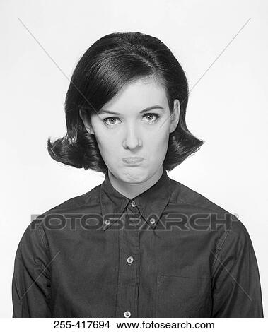 Portrait of young woman sulking View Large Photo Image Picture - Portrait of young woman sulking. Fotosearch