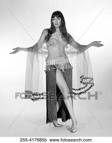 Portrait of young woman wearing belly dance outfit View Large Photo Image Stock Image - Portrait of young woman wearing belly dance outfit. Fotosearch