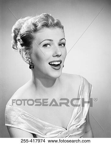 Picture - Portrait of young woman wearing evening dress. Fotosearch