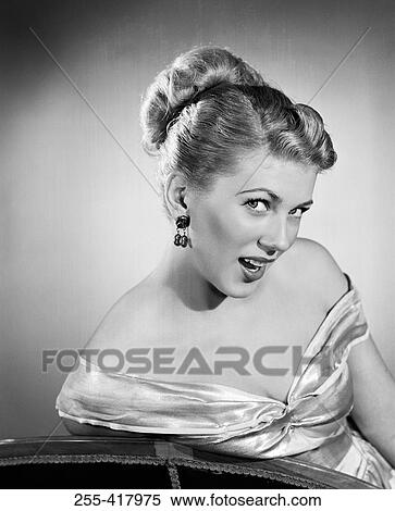 Portrait of young woman wearing evening dress View Large Photo Image Stock Photography - Portrait of young woman wearing evening dress. Fotosearch