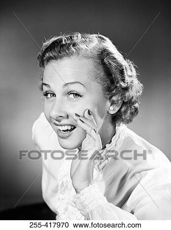 Portrait of young woman whispering View Large Photo Image Stock Image - Portrait of young woman whispering. Fotosearch