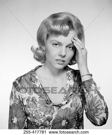 Portrait of young woman with headache, studio shot View Large Photo Image Stock Image - Portrait of young woman with headache, studio shot. Fotosearch