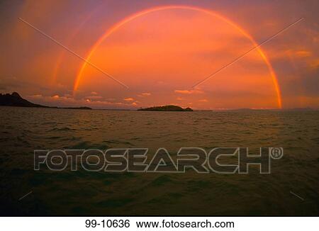 Rainbow over a lagoon, Bora Bora, Tahiti, French Polynesia View Large Photo Image Stock Photograph - Rainbow over a lagoon, Bora Bora, Tahiti, French Polynesia. Fotosearch
