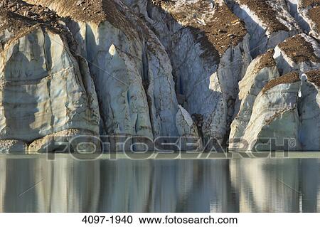 Stock Image - Reflection of a mountain in water, Glacial Lake, Angel Glacier, Mt Edith Cavell, Jasper National Park, Alberta, Canada. Fotosearch