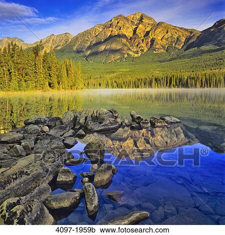 Reflection of a mountain in water, Pyramid Lake, Pyramid Mountain, Jasper National Park, Alberta, Canada View Large Photo Image Stock Image - Reflection of a mountain in water, Pyramid Lake, Pyramid Mountain, Jasper National Park, Alberta, Canada. Fotosearch