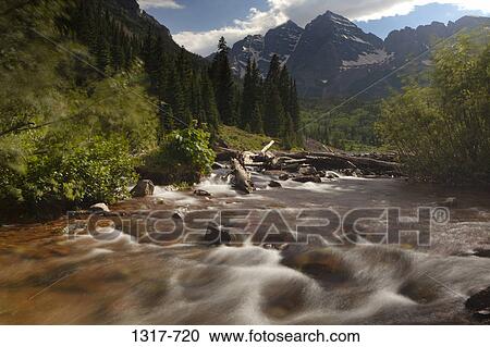 River flowing through mountains, Maroon Bells, Aspen, Colorado, USA View Large Photo Image Stock Image - River flowing through mountains, Maroon Bells, Aspen, Colorado, USA. Fotosearch