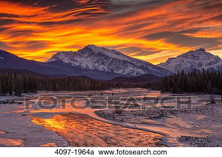 Stock Image - River flowing with a mountain in the background, Athabasca River, Mt Kerkeslin, Jasper National Park, Alberta, Canada. Fotosearch