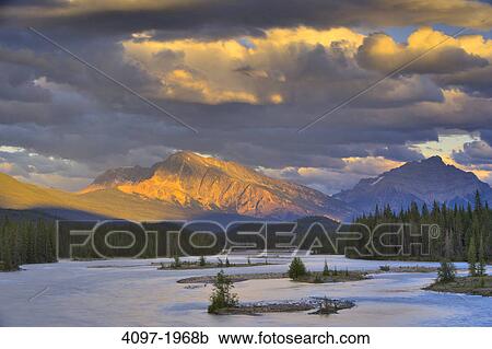 River flowing with a mountain in the background, Athabasca River, Mt Andromeda, Jasper National Park, Alberta, Canada View Large Photo Image Stock Image - River flowing with a mountain in the background, Athabasca River, Mt Andromeda, Jasper National Park, Alberta, Canada. Fotosearch