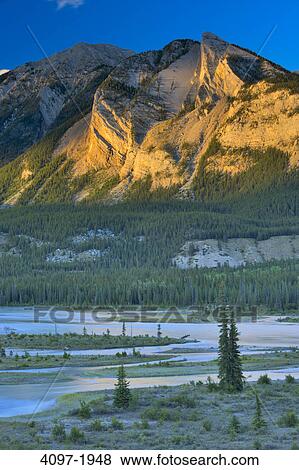 River in front of mountains, Athabasca River, Colin Range, Canadian Rockies, Jasper National Park, Alberta, Canada View Large Photo Image Stock Photo - River in front of mountains, Athabasca River, Colin Range, Canadian Rockies, Jasper National Park, Alberta, Canada. Fotosearch