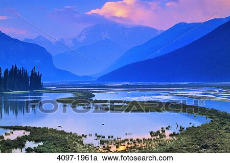 River with mountains in the background, Sunwapta River, Sunwapta Valley, Mt Andromeda, Jasper National Park, Alberta, Canada View Large Photo Image Stock Image - River with mountains in the background, Sunwapta River, Sunwapta Valley, Mt Andromeda, Jasper National Park, Alberta, Canada. Fotosearch