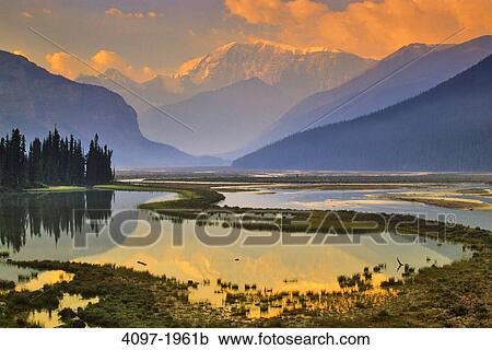 River with mountains in the background, Sunwapta River, Sunwapta Valley, Mt Andromeda, Jasper National Park, Alberta, Canada View Large Photo Image Stock Image - River with mountains in the background, Sunwapta River, Sunwapta Valley, Mt Andromeda, Jasper National Park, Alberta, Canada. Fotosearch