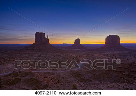 Stock Image - Rock formations in a desert, Monument Valley, Arizona-Utah, USA. Fotosearch