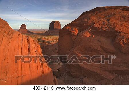 Rock formations in a desert, Monument Valley, Arizona-Utah, USA View Large Photo Image Stock Image - Rock formations in a desert, Monument Valley, Arizona-Utah, USA. Fotosearch