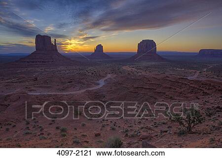 Stock Image - Rock formations in a desert, Monument Valley, Arizona-Utah, USA. Fotosearch