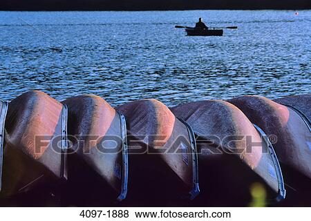 Stock Photo - Rowboats at the lakeside, Maligne Lake, Jasper National Park, Alberta, Canada. Fotosearch