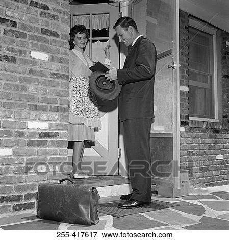 Salesman with woman at front door View Large Photo Image Stock Photo - Salesman with woman at front door. Fotosearch