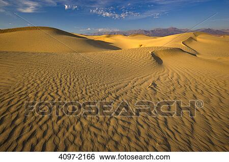 Stock Photograph - Sand dunes in a desert, Mesquite Flat Dunes, Death Valley National Park, California, USA. Fotosearch