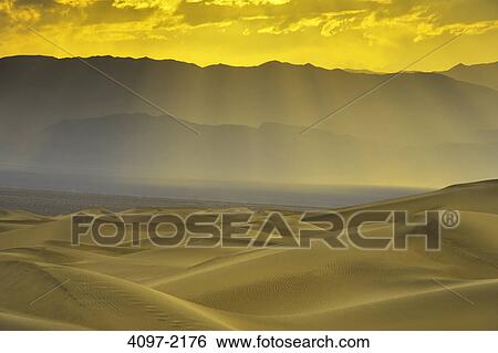 Stock Photograph - Sand dunes in a desert, Mesquite Flat Dunes, Death Valley National Park, California, USA. Fotosearch