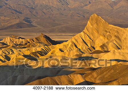 Sand dunes in a desert, Zabriskie Point, Death Valley, Death Valley National Park, California, USA View Large Photo Image Stock Photo - Sand dunes in a desert, Zabriskie Point, Death Valley, Death Valley National Park, California, USA. Fotosearch