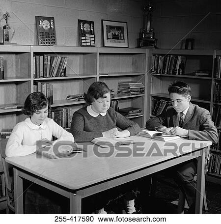 School children reading in library View Large Photo Image Stock Image - School children reading in library. Fotosearch