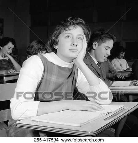 School girl daydreaming in classroom View Large Photo Image Picture - School girl daydreaming in classroom. Fotosearch