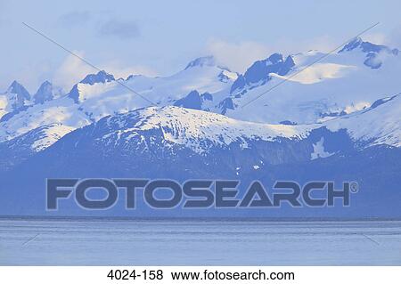 Sea with snow covered mountains in the background, Icy Strait, Alexander Archipelago, Alaska, USA View Large Photo Image Stock Photo - Sea with snow covered mountains in the background, Icy Strait, Alexander Archipelago, Alaska, USA. Fotosearch