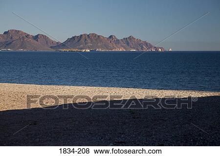 Stock Photo - Shadow on the beach with mountains in the background, San Carlos, Sea of Cortez, Guaymas, Sonora, Mexico. Fotosearch