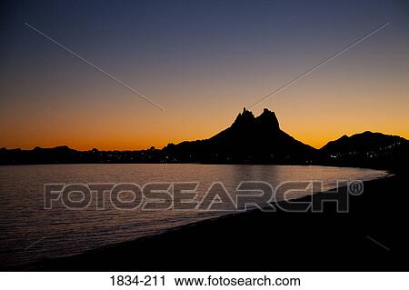 Silhouette of a mountain peak at sunset, San Carlos, Sea of Cortez, Guaymas, Sonora, Mexico View Large Photo Image Stock Image - Silhouette of a mountain peak at sunset, San Carlos, Sea of Cortez, Guaymas, Sonora, Mexico. Fotosearch