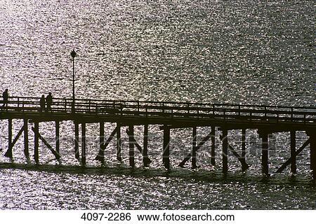 Silhouette of a pier in the sea, White Rock, Fraser Valley, British Columbia, Canada View Large Photo Image Stock Photograph - Silhouette of a pier in the sea, White Rock, Fraser Valley, British Columbia, Canada. Fotosearch