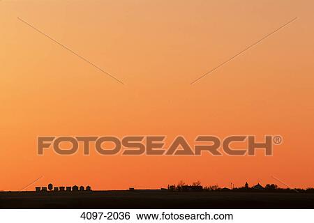 Silhouette of structures in a field, Alberta, Canada View Large Photo Image Stock Photograph - Silhouette of structures in a field, Alberta, Canada. Fotosearch