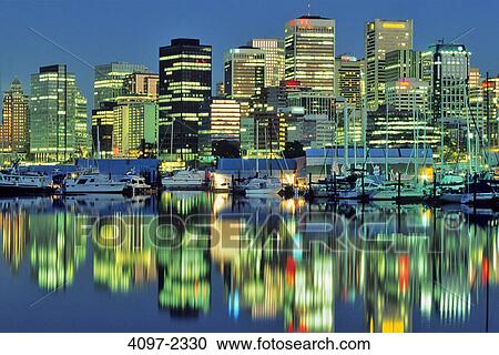 Skyscrapers in a city lit up at dusk, Coal Harbor, Vancouver, British Columbia, Canada View Large Photo Image Stock Image - Skyscrapers in a city lit up at dusk, Coal Harbor, Vancouver, British Columbia, Canada. Fotosearch