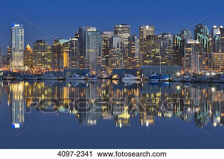 Skyscrapers in a city lit up at dusk, Coal Harbor, Vancouver, British Columbia, Canada View Large Photo Image Stock Image - Skyscrapers in a city lit up at dusk, Coal Harbor, Vancouver, British Columbia, Canada. Fotosearch