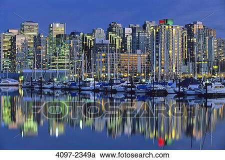 Skyscrapers in a city lit up at dusk, Coal Harbor, Vancouver, British Columbia, Canada View Large Photo Image Stock Image - Skyscrapers in a city lit up at dusk, Coal Harbor, Vancouver, British Columbia, Canada. Fotosearch