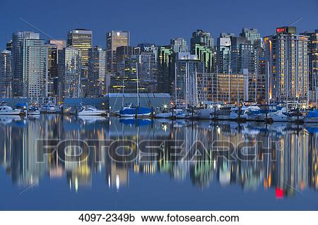 Skyscrapers in a city lit up at dusk, Coal Harbor, Vancouver, British Columbia, Canada View Large Photo Image Stock Image - Skyscrapers in a city lit up at dusk, Coal Harbor, Vancouver, British Columbia, Canada. Fotosearch
