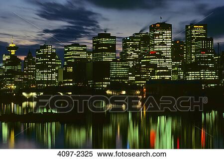 Skyscrapers in a city lit up at night, Coal Harbor, Vancouver, British Columbia, Canada View Large Photo Image Stock Photography - Skyscrapers in a city lit up at night, Coal Harbor, Vancouver, British Columbia, Canada. Fotosearch
