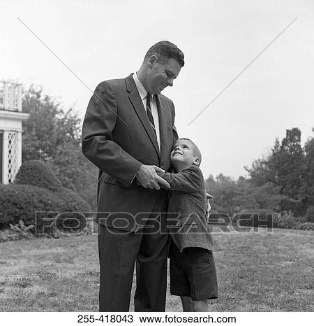 Son embracing father View Large Photo Image Stock Image - Son embracing father. Fotosearch