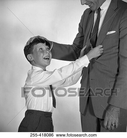 Son playing with father View Large Photo Image Stock Photograph - Son playing with father. Fotosearch