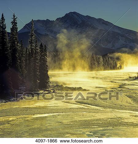 Stock Photograph - Steam emerging from a hot spring, Jasper National Park, Alberta, Canada. Fotosearch
