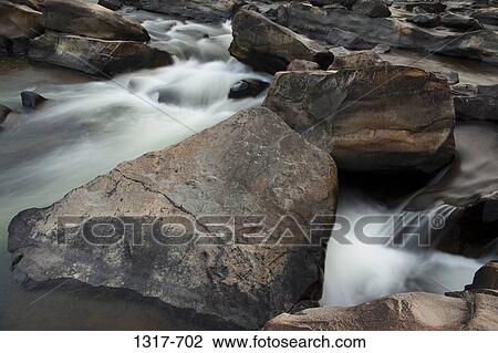 Stream flowing through rocks, Cossatot Falls, Arkansas, USA View Large Photo Image Stock Image - Stream flowing through rocks, Cossatot Falls, Arkansas, USA. Fotosearch